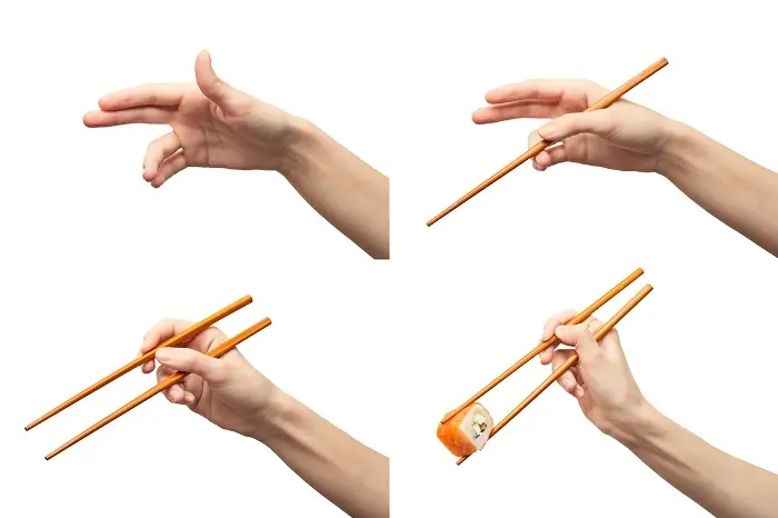 como coger los palillos chinos